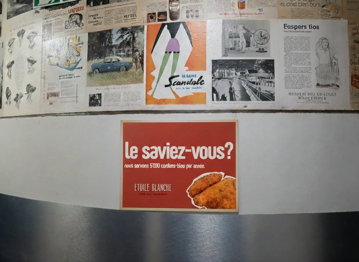 Red “Did you know?” card on a wall covered with old posters